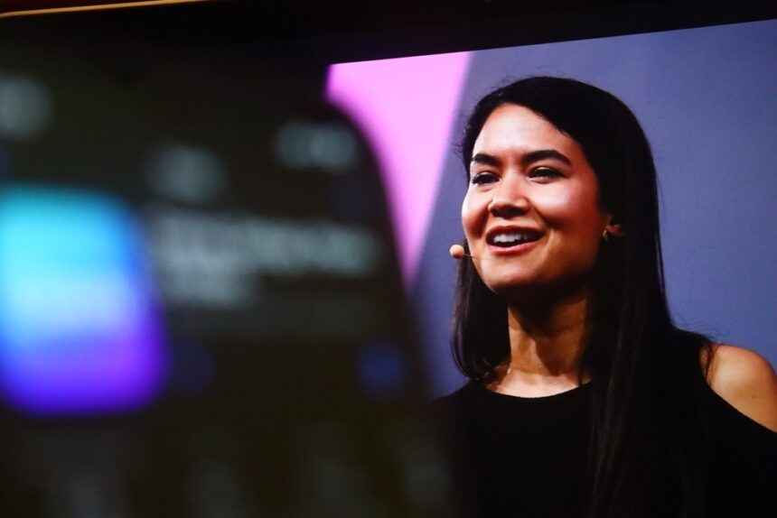 Melanie Perkins, CEO and co-founder of Canva, smiling at a public event
