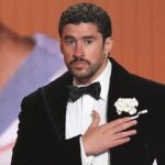 Bad Bunny performing on stage after winning a Grammy Award